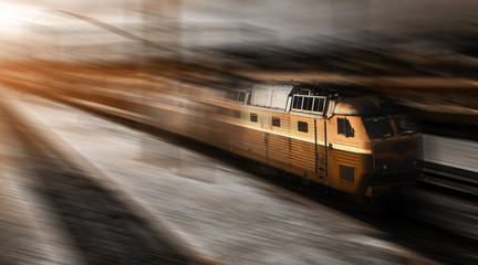 Fototapeta na wymiar high-speed train in motion with railcars at the platform