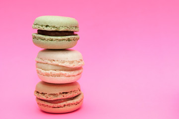 Macaroons close up on a pink background, selection of macaroons