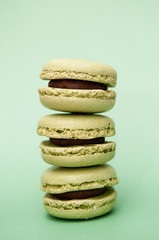 Macaroons close up on a green background, pistachio macaroons