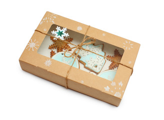 ginger cookies with blue frosting in a box on white background