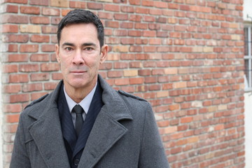 Mature handsome Caucasian businessman smiling with copy space 