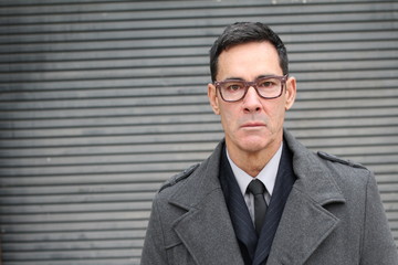 Stern looking businessman close up with copy space 