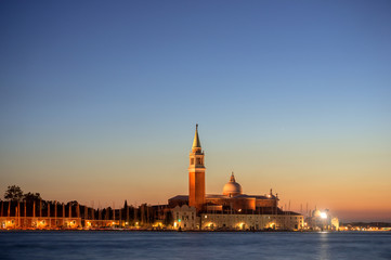 sunset, night view from the sea on illuminated Venice, Italy. 