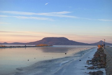 Sunset at the dock at Lake Balaton frozen