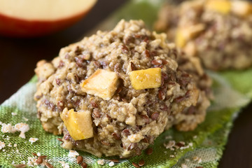 Freshly baked apple, oatmeal and linseed cookies, photographed with natural light (Selective Focus, Focus in the middle of the image)