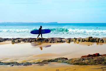 Fototapeta na wymiar Surfer on the beach