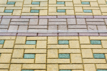Fototapeta na wymiar Texture, background, colorful area lined with paving slabs
