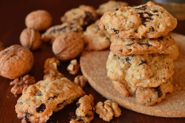 Homemade oat-nut-chocolate cookies with walnuts in shell