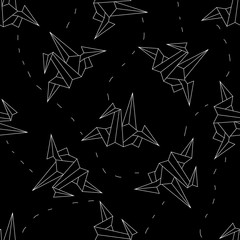 seamless background white origami crane on a black 