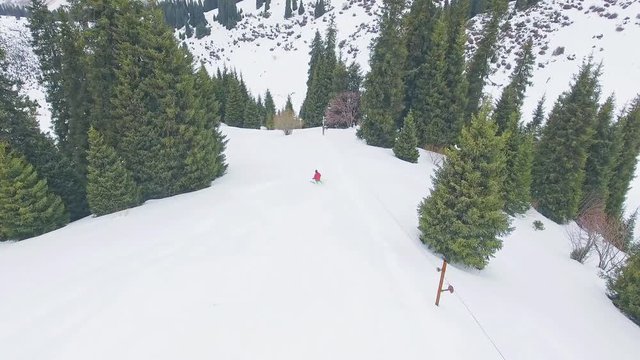 Aerial view footage of skier riding at mountain, winter