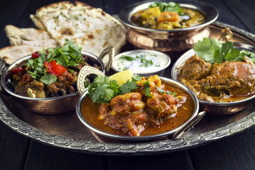 Traditional Indian Curry Dishes as close-up on Thali © HLPhoto