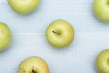 Green apples on vintage background