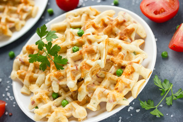 Waffles with cheese, green peas and sausage