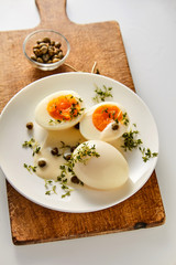 Boiled eggs with capers and mustard sauce