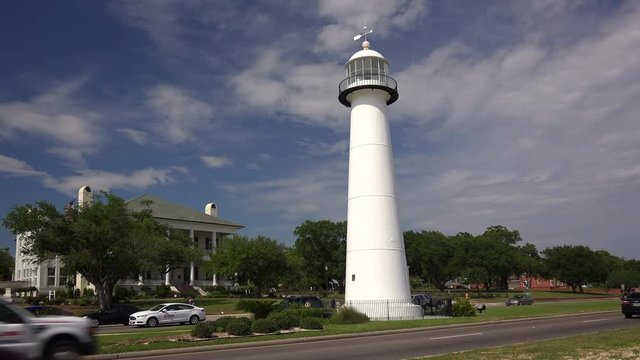 Lighthouse as cars drive past in Biloxi, Mississippi