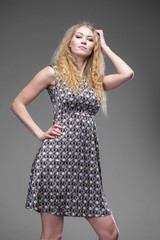 Young blond lady in sexy dress