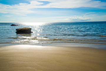 Golden beach blue sea and blue sky