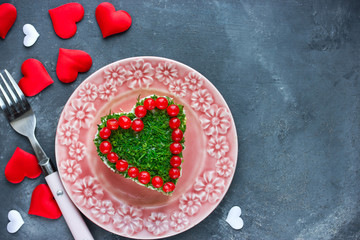 Delicious appetizer layered salad shaped heart