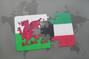 puzzle with the national flag of wales and kuwait on a world map