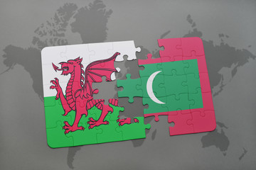 puzzle with the national flag of wales and maldives on a world map