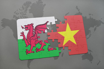 puzzle with the national flag of wales and vietnam on a world map