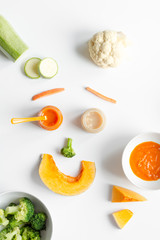 cooking vegetable puree for baby on white background top view