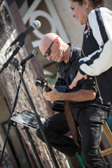 Music Duo Performing at an Outdoor Venue