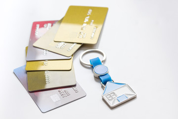 credit cards, key ring - concept mortgage on white background