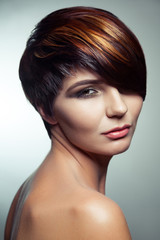 Fashion portrait of a beautiful girl with colored dyed hair, professional short hair coloring. studio shot.