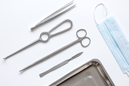 instruments for plastic surgery on white background top view