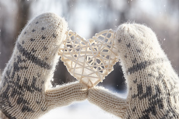 Rattan red heart in hands