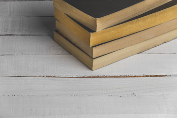 Wooden Bookshelf with old books. Close up image with copy space. Top view