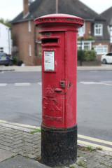 Fototapeta na wymiar Red pillar post box, London, UK. King George