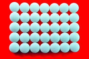 white tables on red background 