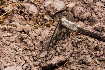 close up of equipment of farmer with ground on farm. copy space for text.