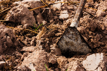 close up of equipment of farmer with ground on farm. copy space for text.