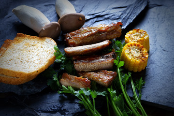 Homemade Smoked Barbecue Pork Ribs Ready to Eat, on stone background