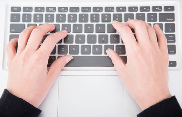 Fototapeta na wymiar Closeup woman typing on laptop computer