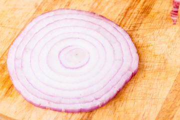 Fototapeta na wymiar onion slice on cutting board