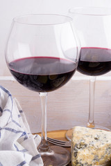 glasses with wine on a white tray