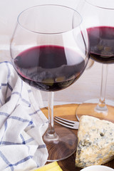 Red wine in glasses and snacks