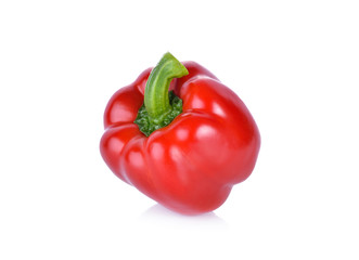 whole fresh red bell pepper with stem on white background