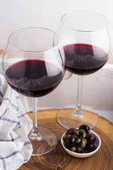 glasses with red wine on a tray