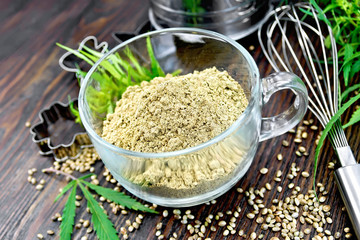 Flour hemp in glass cup on board