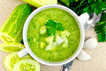 Soup cucumber in white bowl on stone table top