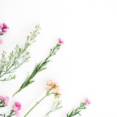 Colorful wildflowers on white background. Flat lay, top view. Valentine's background