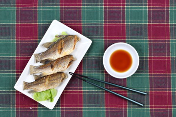 Deep fried small snapper with bean sauce.