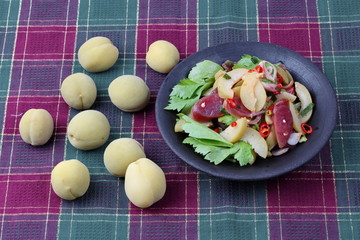 Spicy sour Chinese sausage salad with Peach honey - compote .