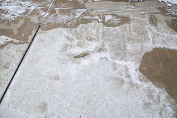 winter ice melting salt on the ground, pattern as background
