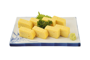 Tamago set in white square dish. Sweet Omelet or egg roll in Japaneses tradition style with isolated background